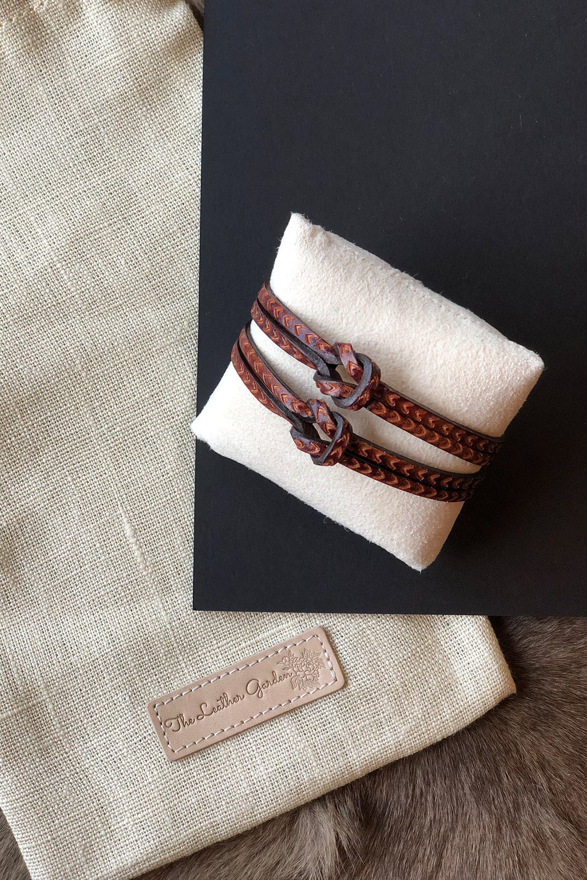 Hand tooled bracelet with knot detail