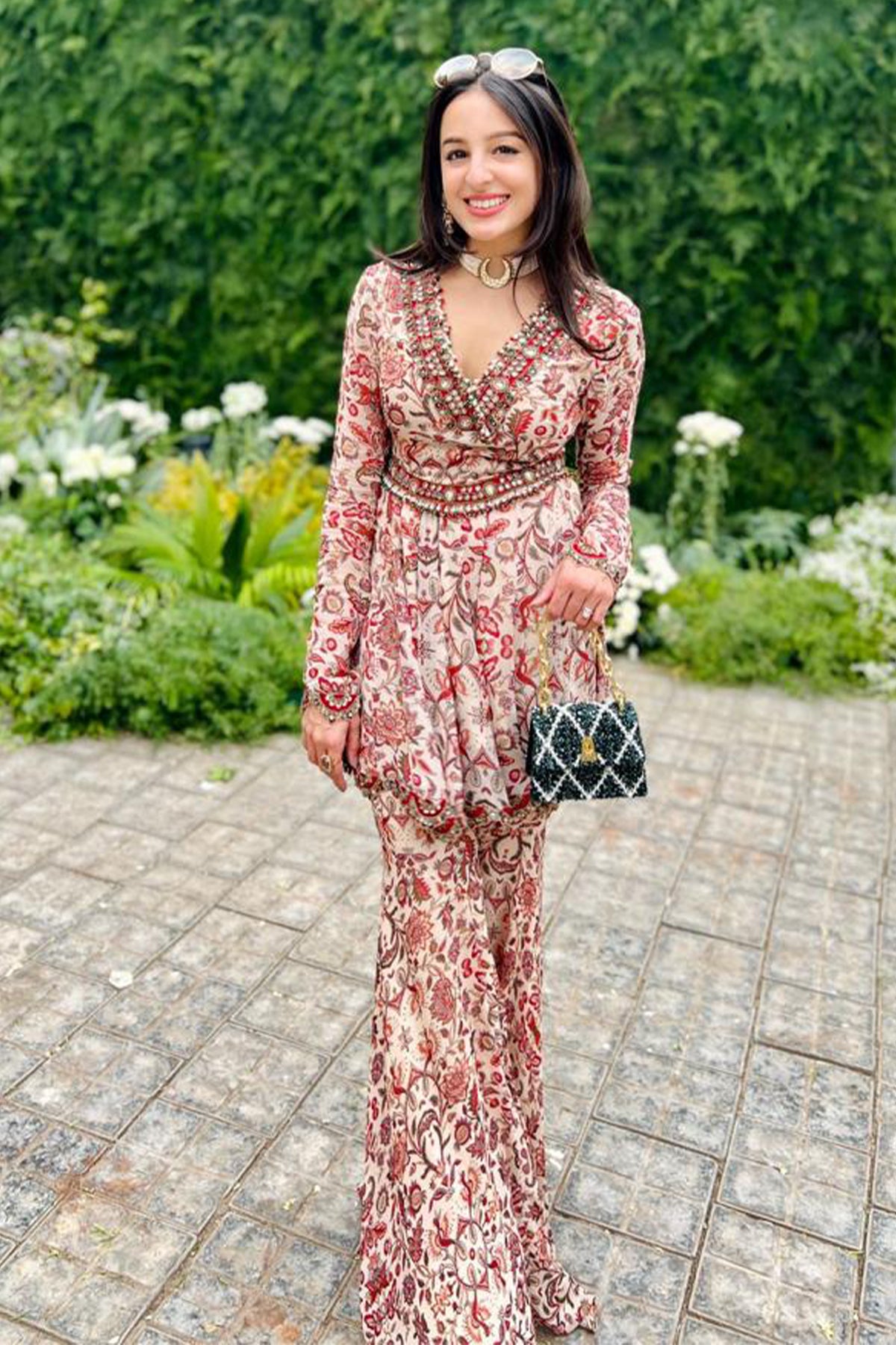 Tarini Manchanda with the Erica Emerald Handheld Mini Bag