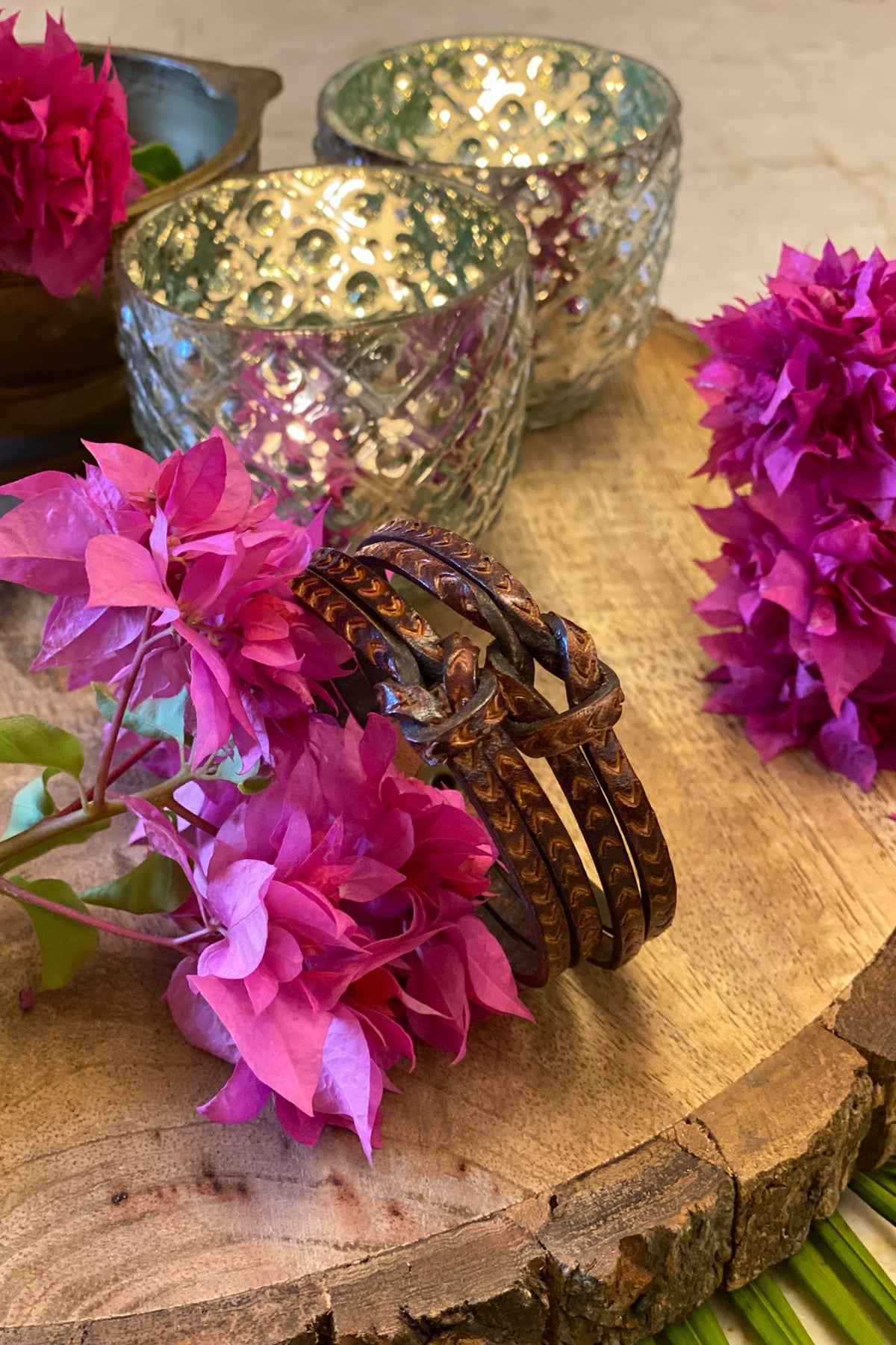 Hand tooled bracelet with knot detail