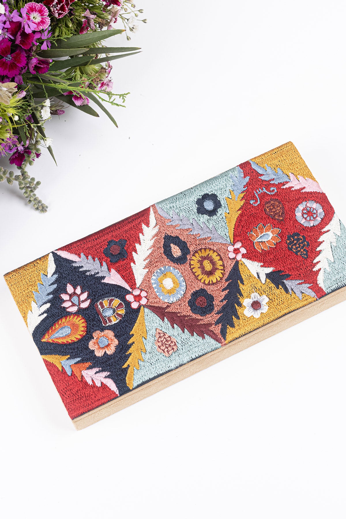 Multicolored embroidered money box