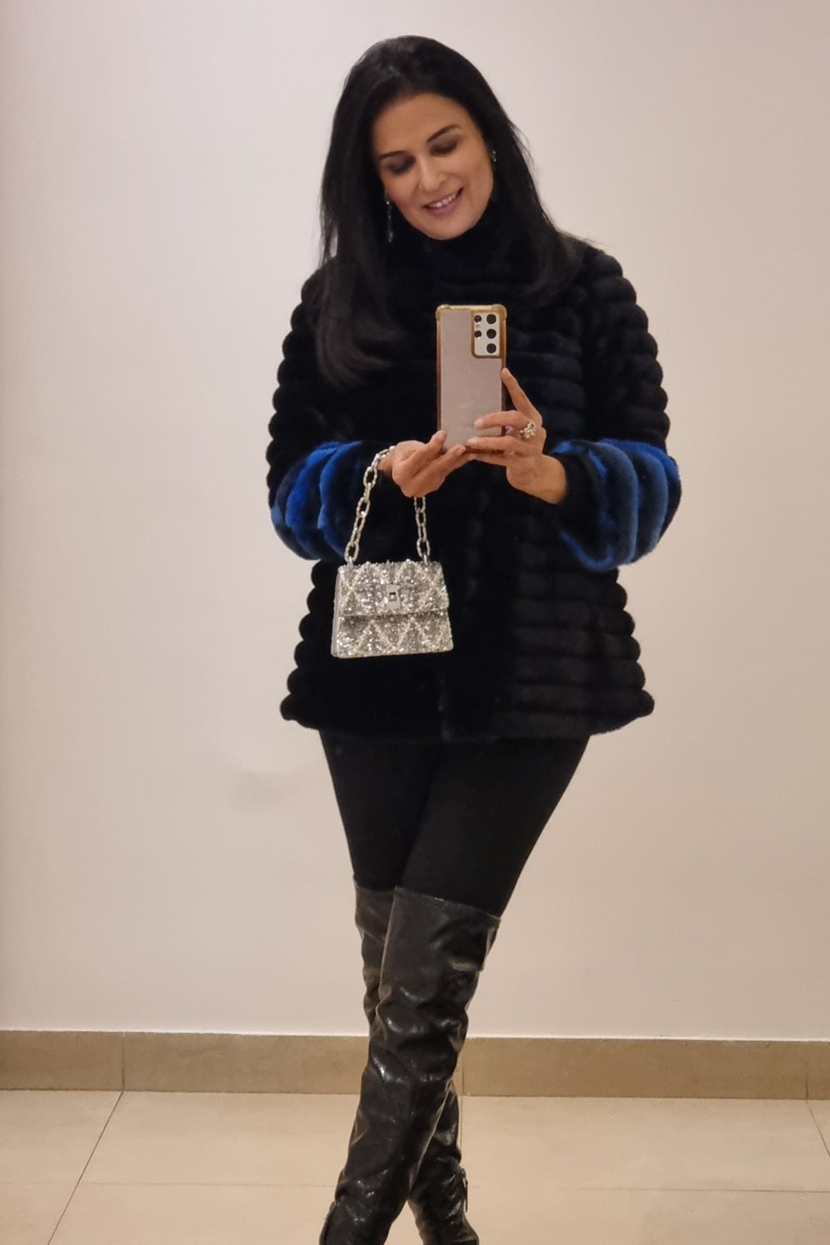 Divya Gurwara with the Erica Smoky Quartz Handheld Bag