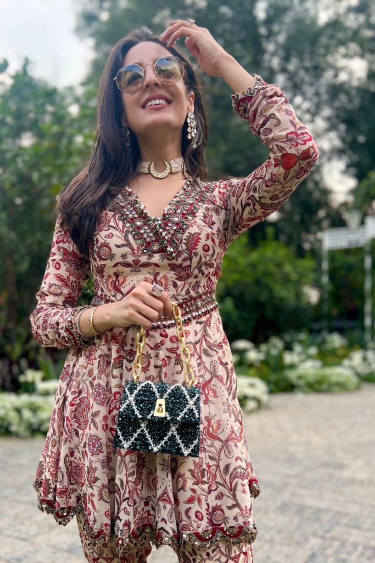 Tarini Manchanda with the Erica Emerald Handheld Mini Bag