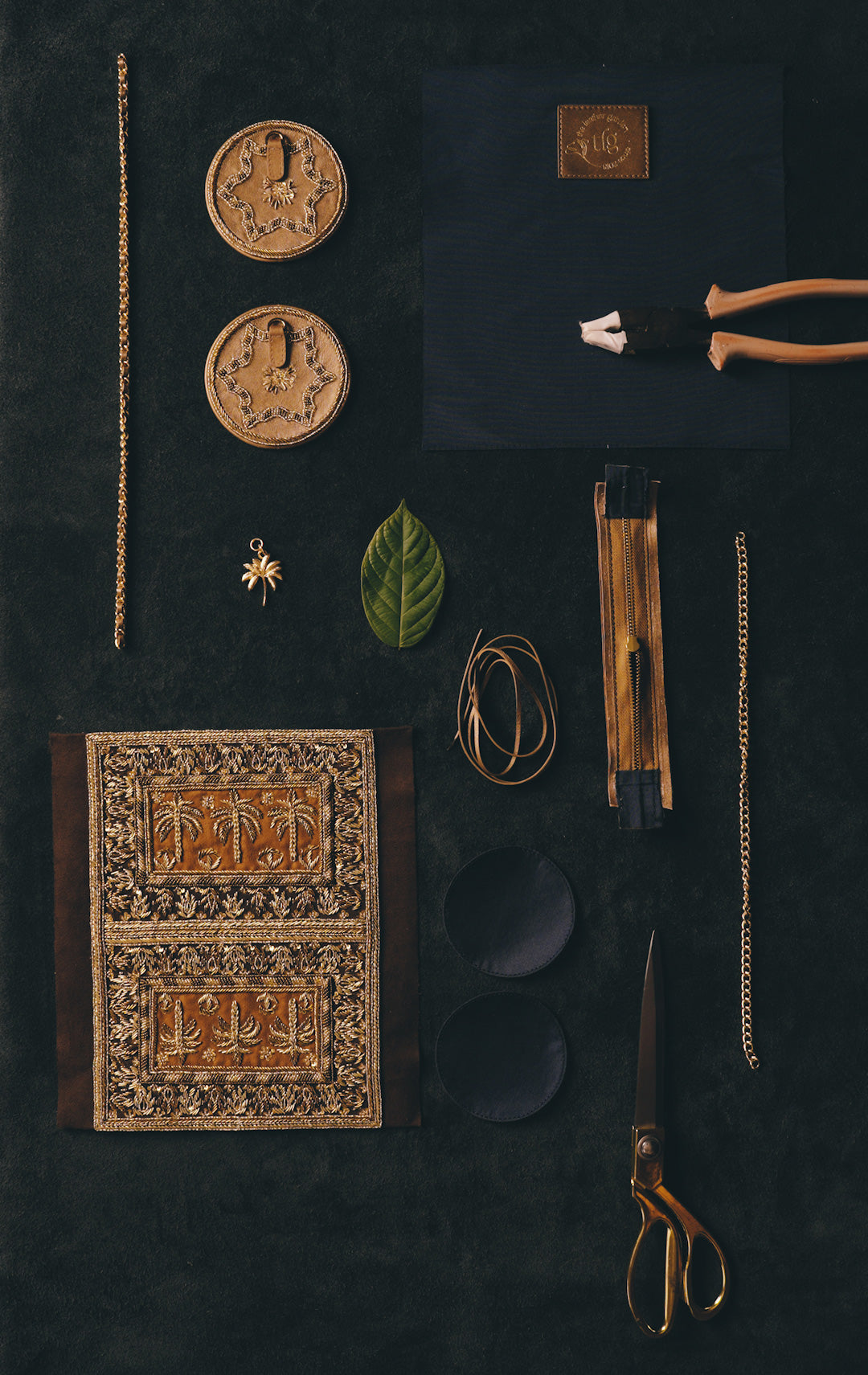 Leather-working tools and materials on a craft table