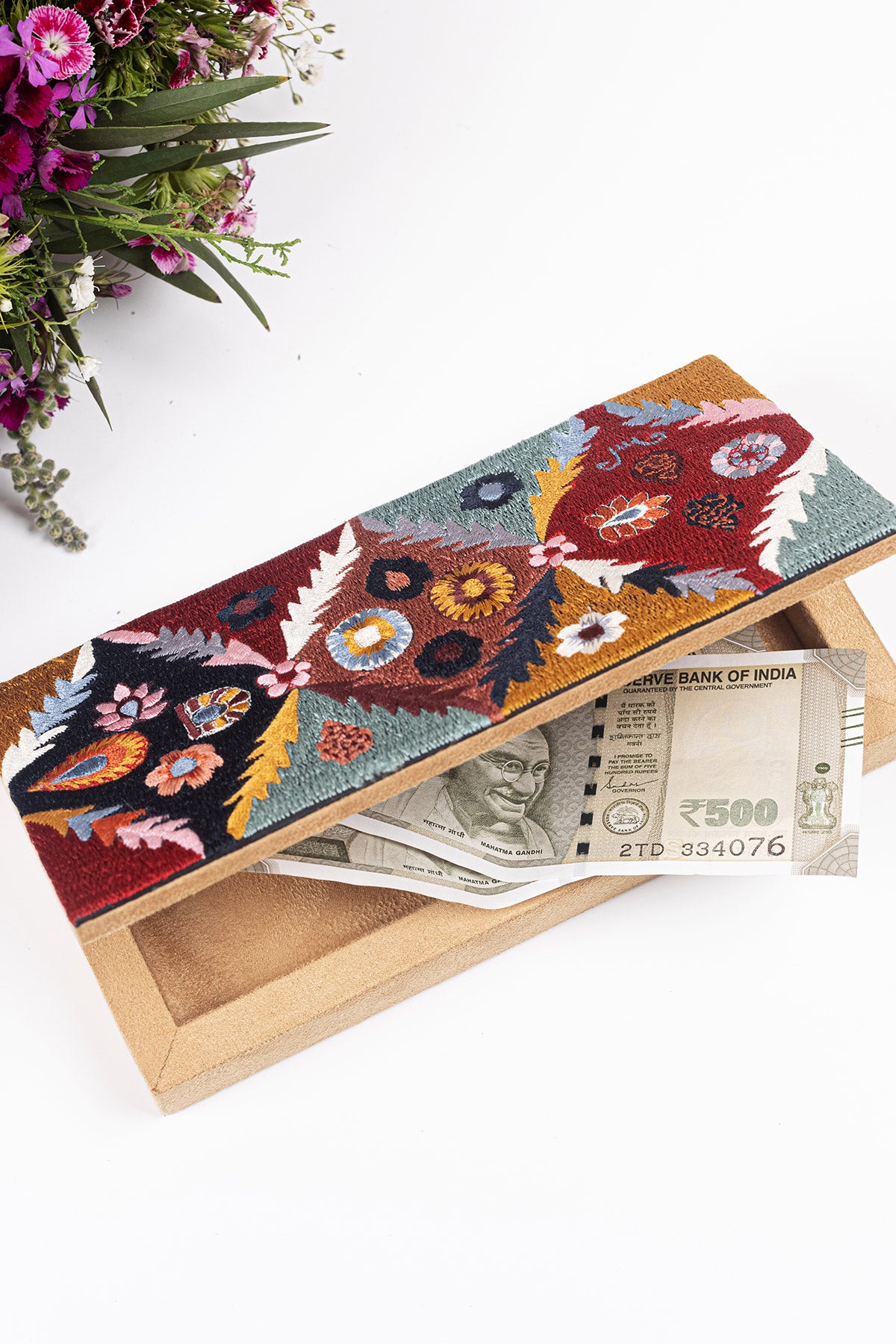 Multicolored embroidered money box